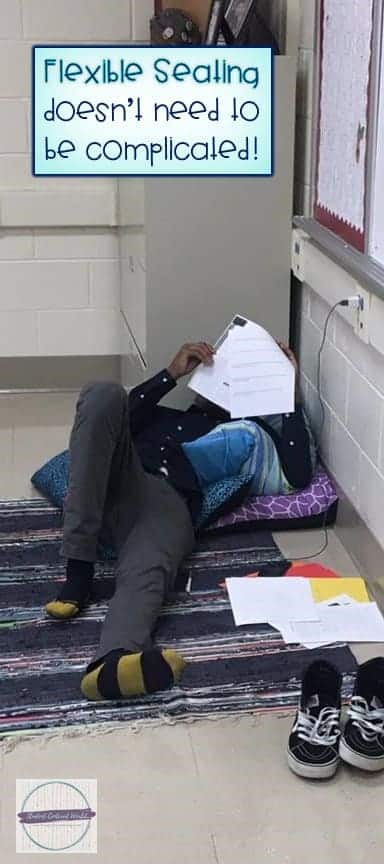 boy laying on rug and pillows in classroom while working on assignment under caption, "flexible seating doesn't need to be complicated"