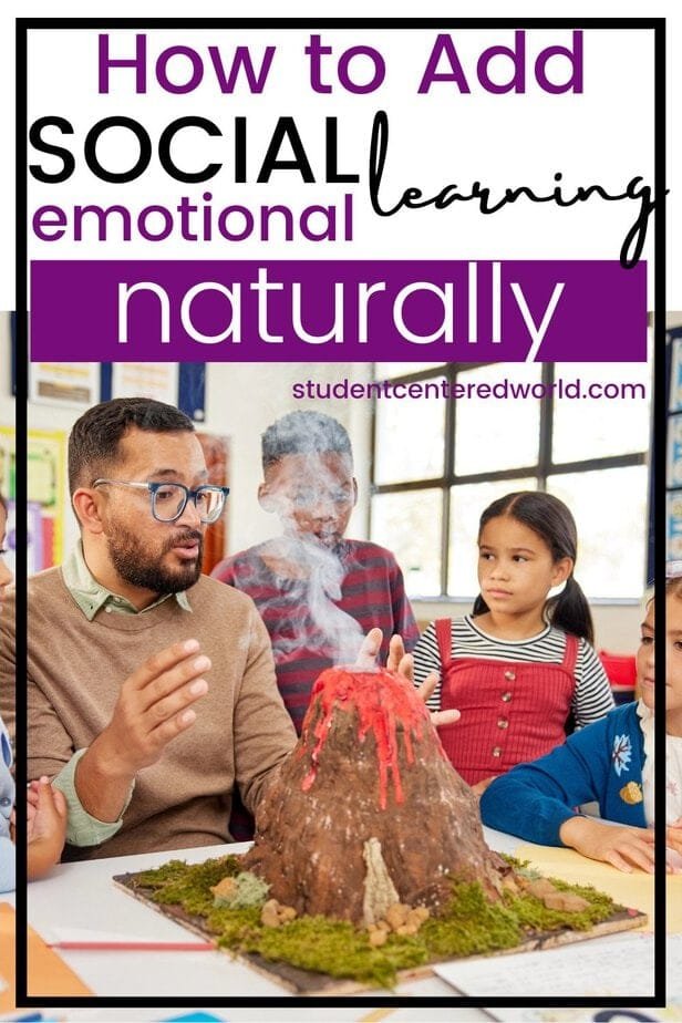 A teacher explains a smoking volcano model to a group of children gathered around a table in a colorful classroom, naturally weaving in social-emotional learning. Overlaid text reads, How to Add Social Emotional Learning Naturally.