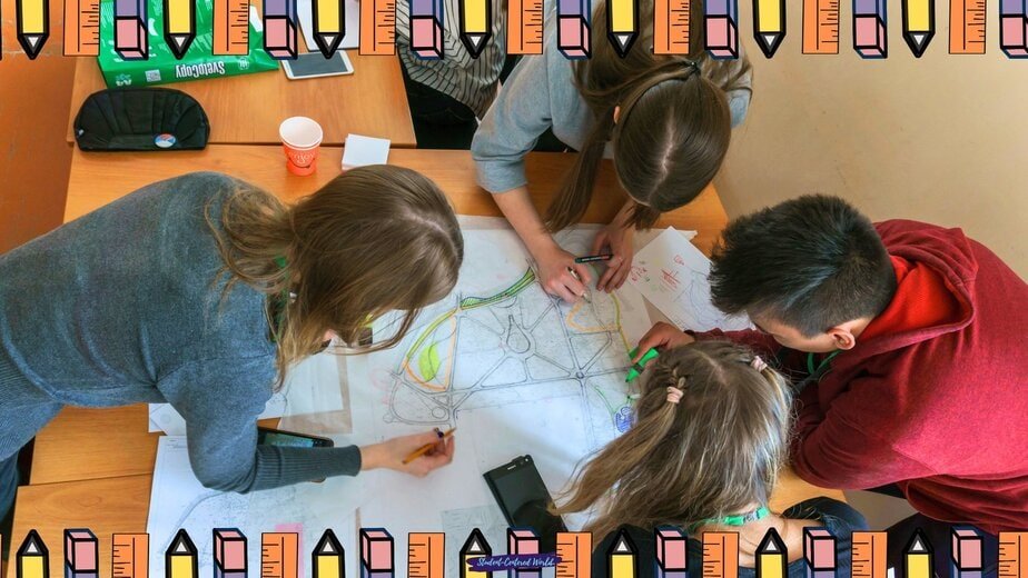 Four students work together on a large paper with maps and colored pencils, illustrating different types of student engagement. The image features a border of cartoon pencils in various colors around the edges.