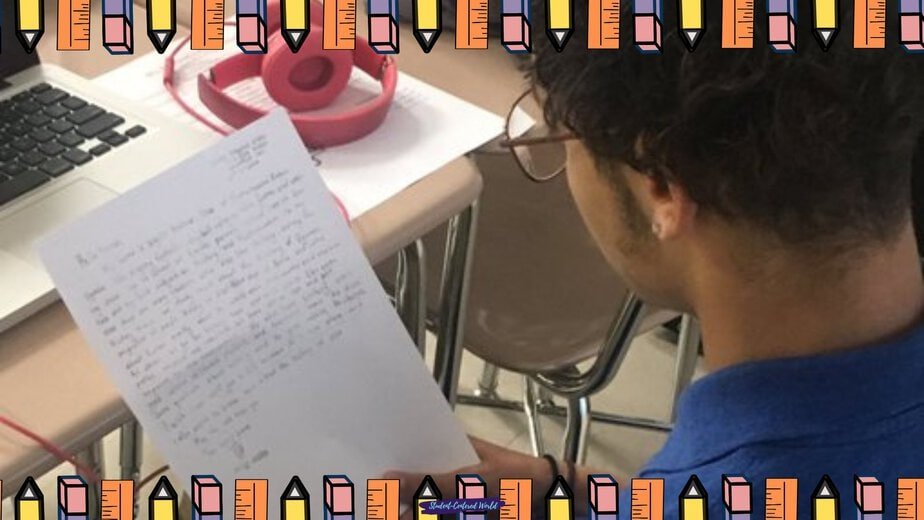 A student wearing glasses sits at a desk, reading a handwritten letter. Nearby are pink headphones and part of a laptop, hinting at student online learning. The image has a colorful pencil border.