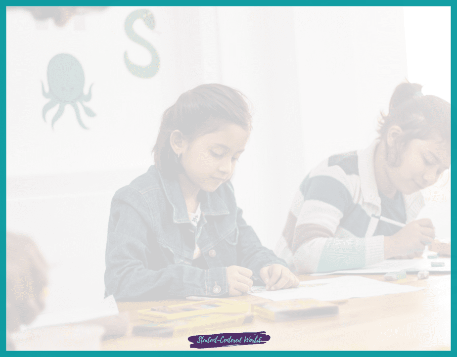 Two children sit at a table, immersed in their work. One is writing diligently while the other looks on, both surrounded by art supplies. An octopus decoration adorns the wall behind them, subtly reminding them of the classroom challenges they conquer each day.