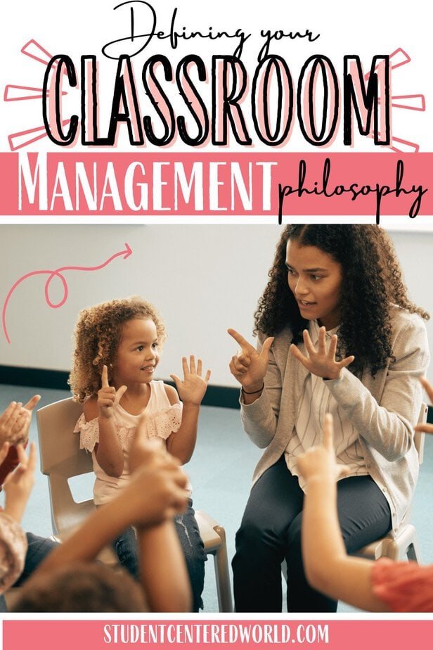 A teacher sits with young students, using hand gestures to explain a concept as part of her classroom management philosophy. The children are engaged, raising their hands. Text reads: Defining your classroom management philosophy.